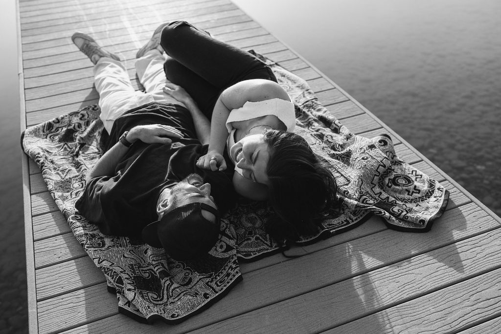 Kelowna engagement photographer session on a dock by the okanagan lake