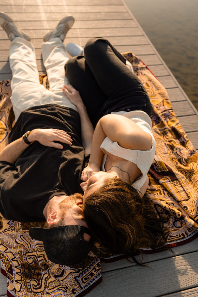 Kelowna engagement photographer session on a dock by the okanagan lake