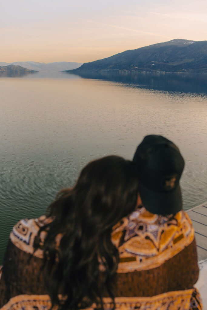 Kelowna engagement photographer session on a dock by the okanagan lake