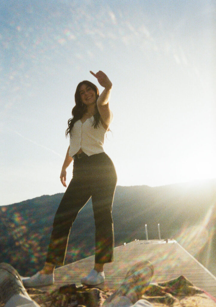 Kelowna engagement photographer session on a dock by the okanagan lake
