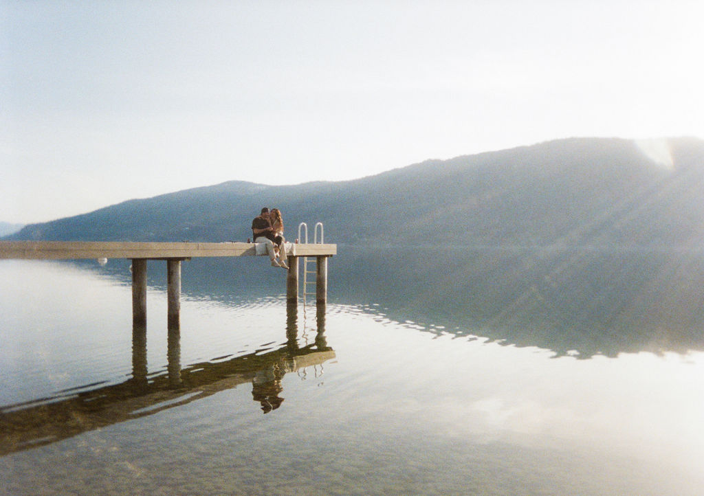 Kelowna engagement photographer session on a dock by the okanagan lake